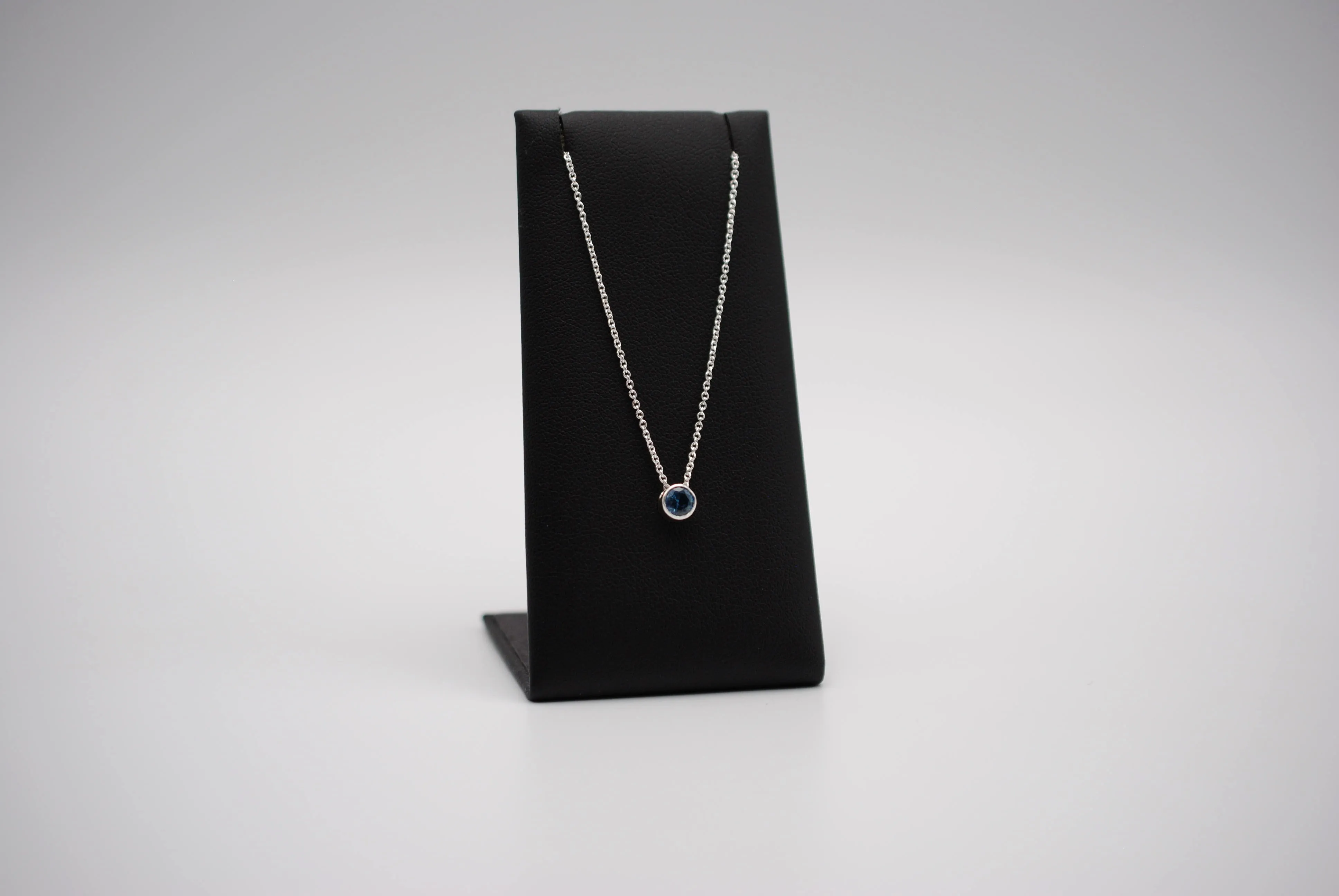 Birthstone Necklace: Round Blue Zircon, Bezel, Silver, Cable Chain