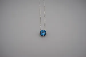 Birthstone Necklace: Round Blue Zircon, Silver Prong Setting, Adjustable Chain