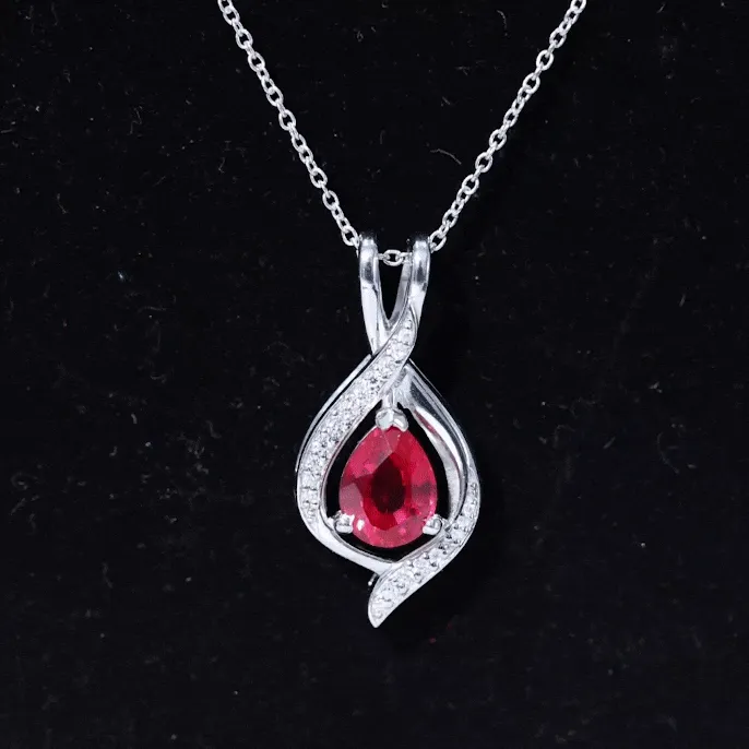 Pear Cut Created Ruby Teardrop Pendant with Moissanite Accent