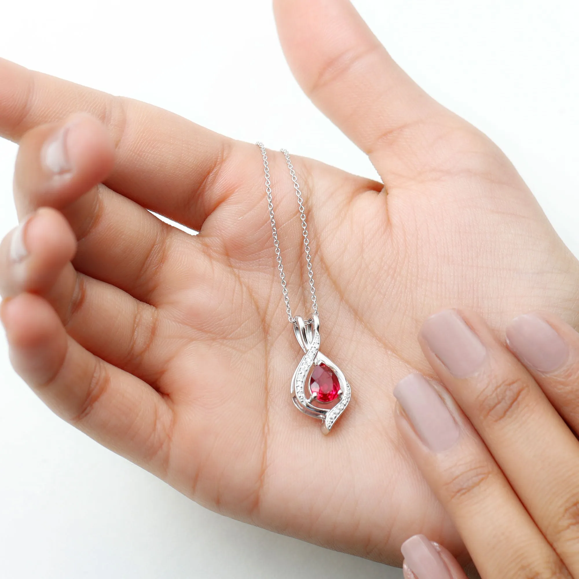 Pear Cut Created Ruby Teardrop Pendant with Moissanite Accent