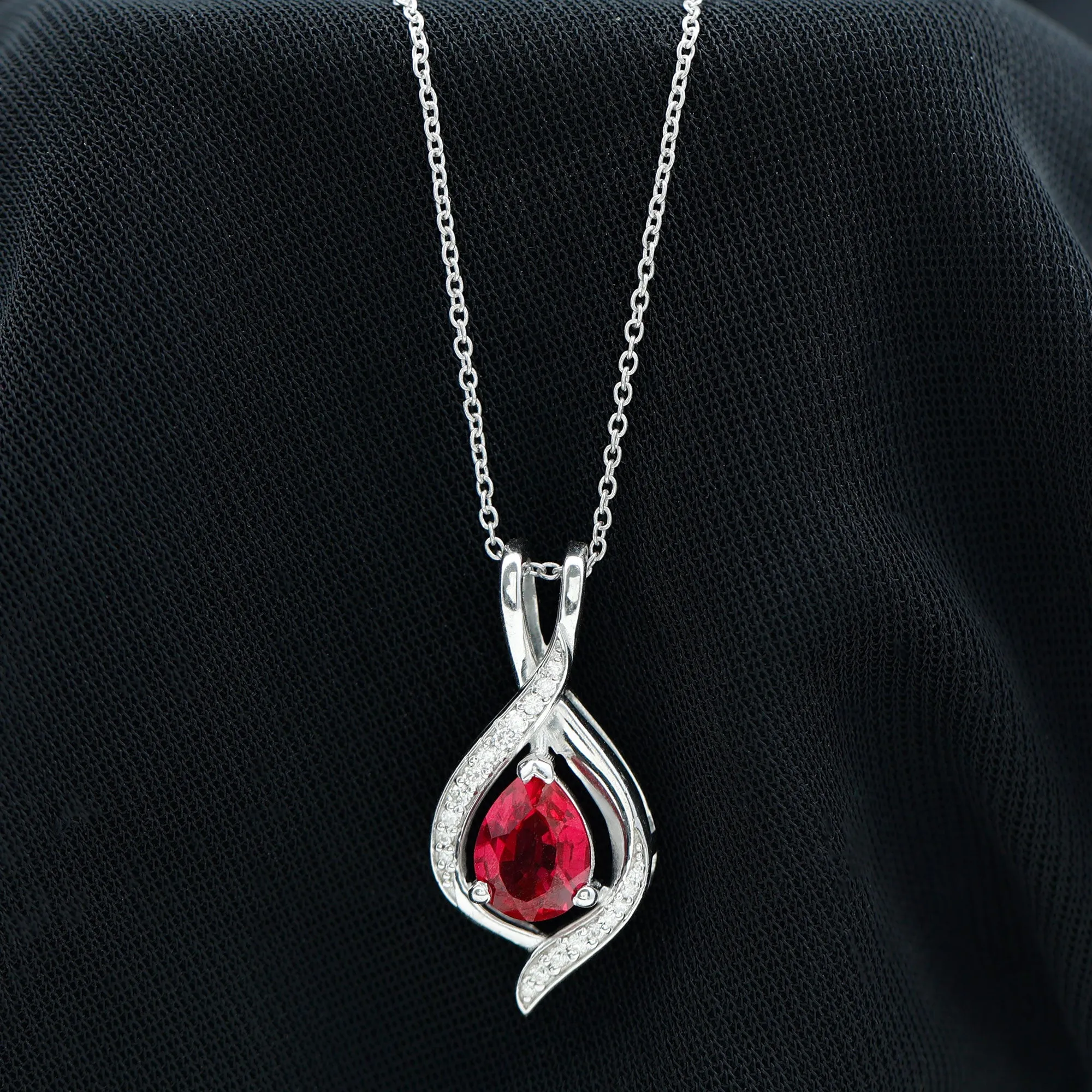 Pear Cut Created Ruby Teardrop Pendant with Moissanite Accent