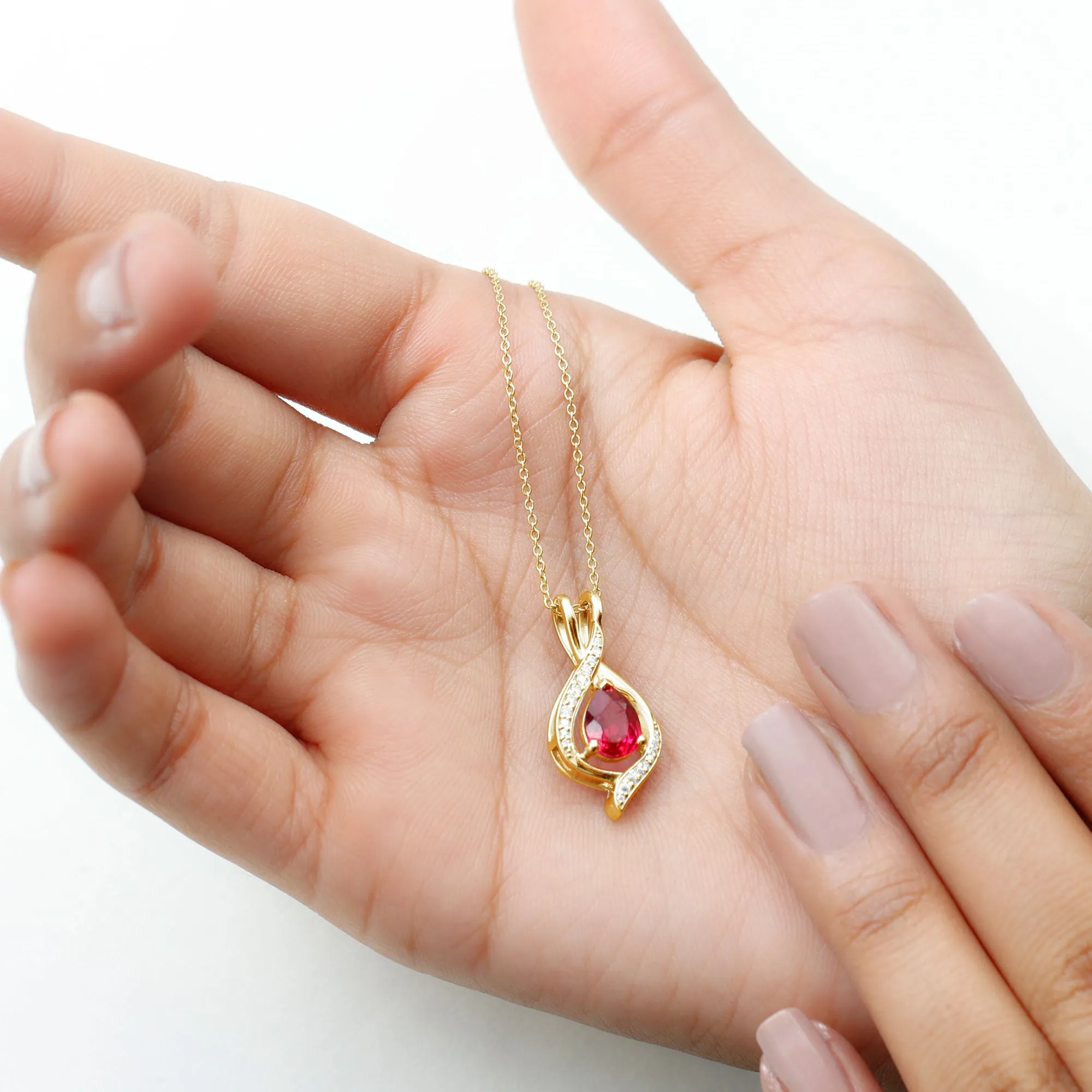 Pear Cut Created Ruby Teardrop Pendant with Moissanite Accent