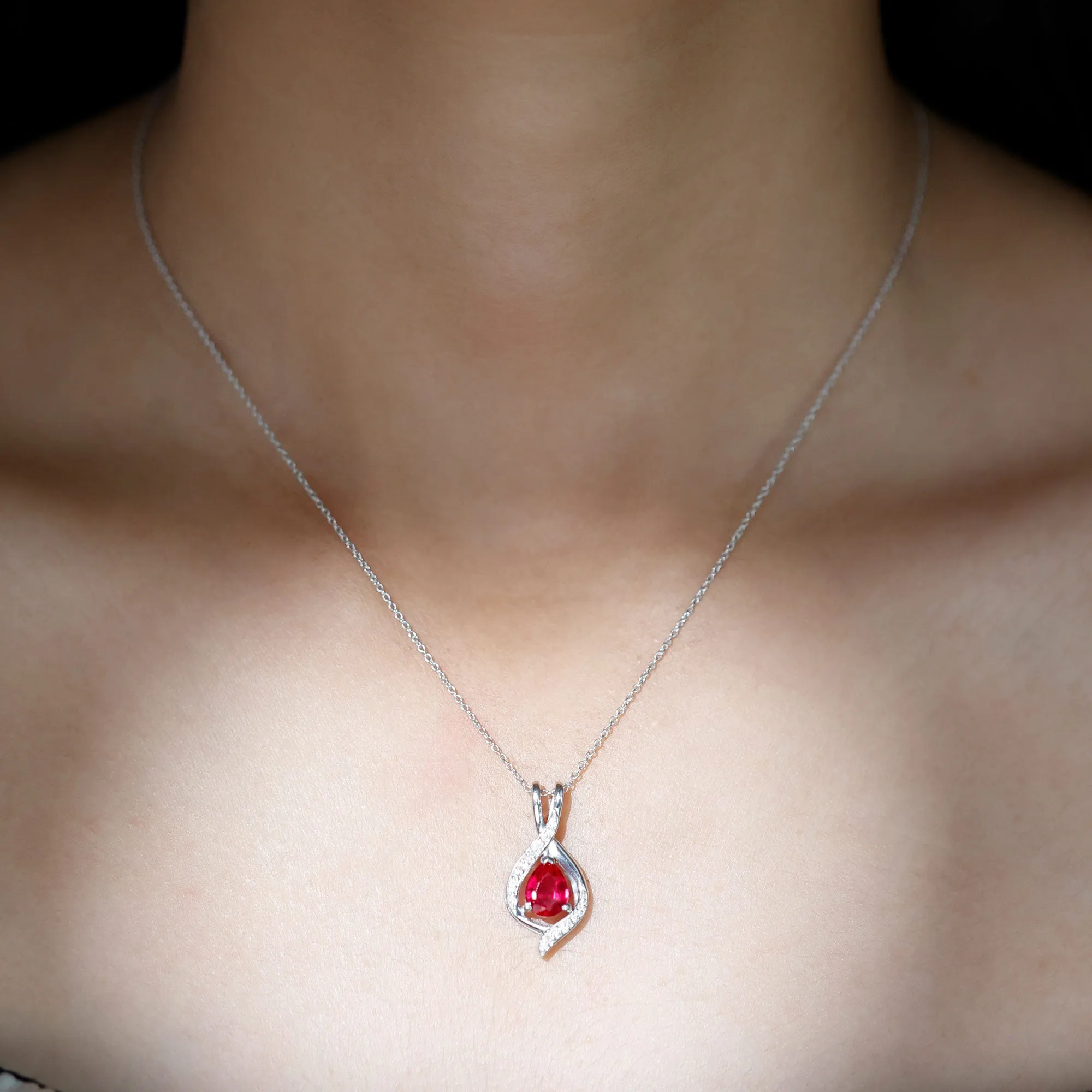 Pear Cut Created Ruby Teardrop Pendant with Moissanite Accent