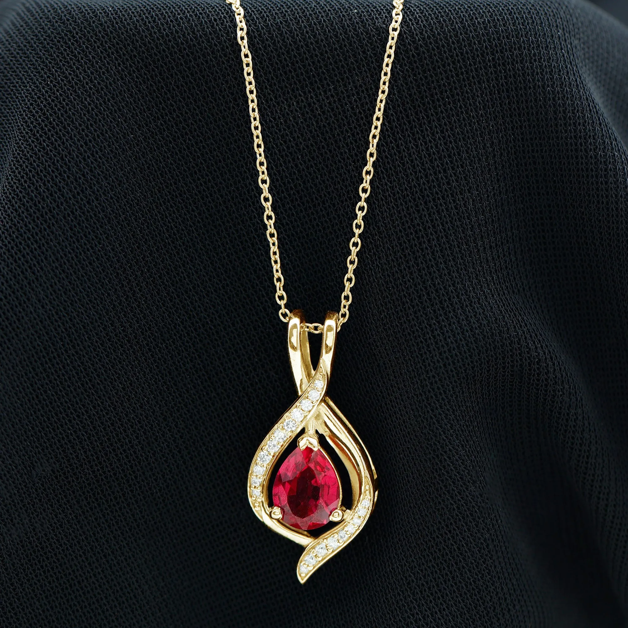 Pear Cut Created Ruby Teardrop Pendant with Moissanite Accent