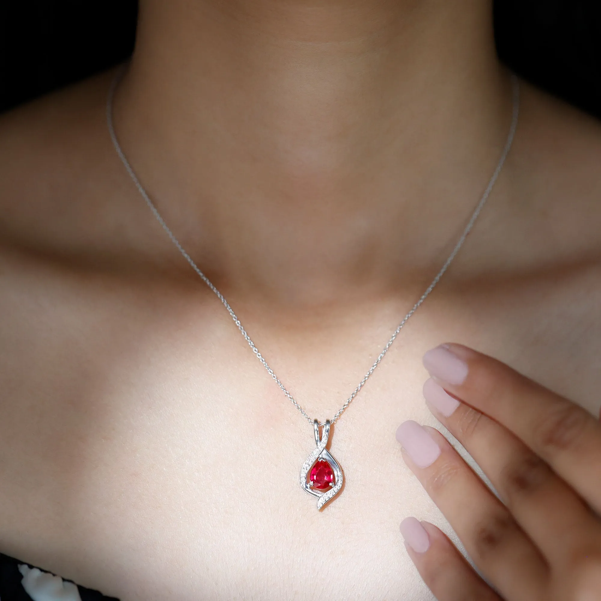 Pear Cut Created Ruby Teardrop Pendant with Moissanite Accent