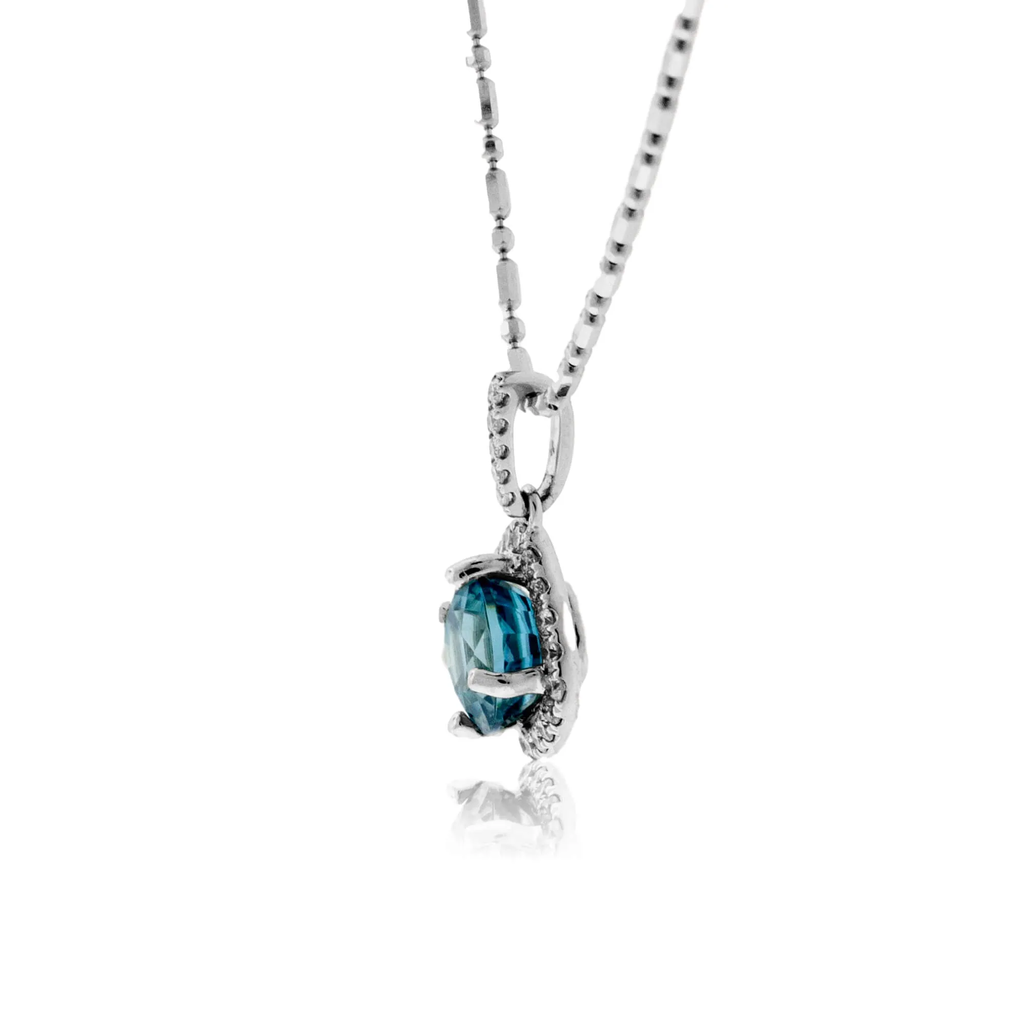 Simple Blue Zircon in Diamond Halo Drop Pendant